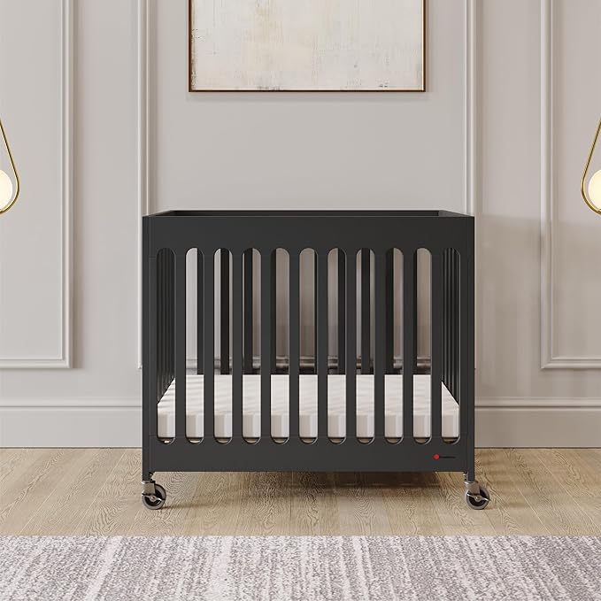 Foundations Boutique Folding Mini Baby Crib - Compact, Portable, Wooden Hotel Crib, Foldable Compact Cribs for Baby & Toddlers - Includes 3" Foam Mattress - Ebony