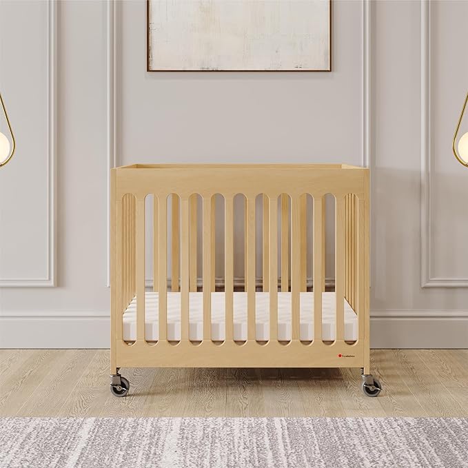 Foundations Boutique Folding Mini Baby Crib - Compact, Portable, Wooden Hotel Crib, Foldable Mini Cribs for Baby & Toddlers - Includes 3" Foam Mattress - Natural