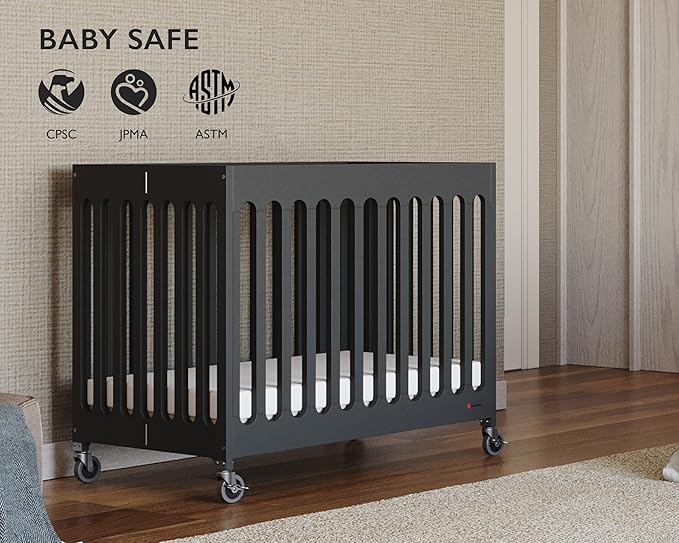 Foundations Boutique Folding Mini Baby Crib - Compact, Portable, Wooden Hotel Crib, Foldable Compact Cribs for Baby & Toddlers - Includes 3" Foam Mattress - Ebony